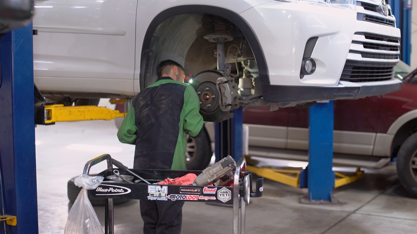 Image of Brown's Automotive Tech working on a fleet vehicle